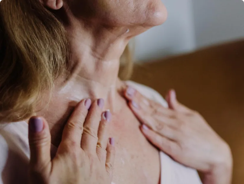 Close-up of a woman's back with natural skin, displaying signs of thinness and dehydration.