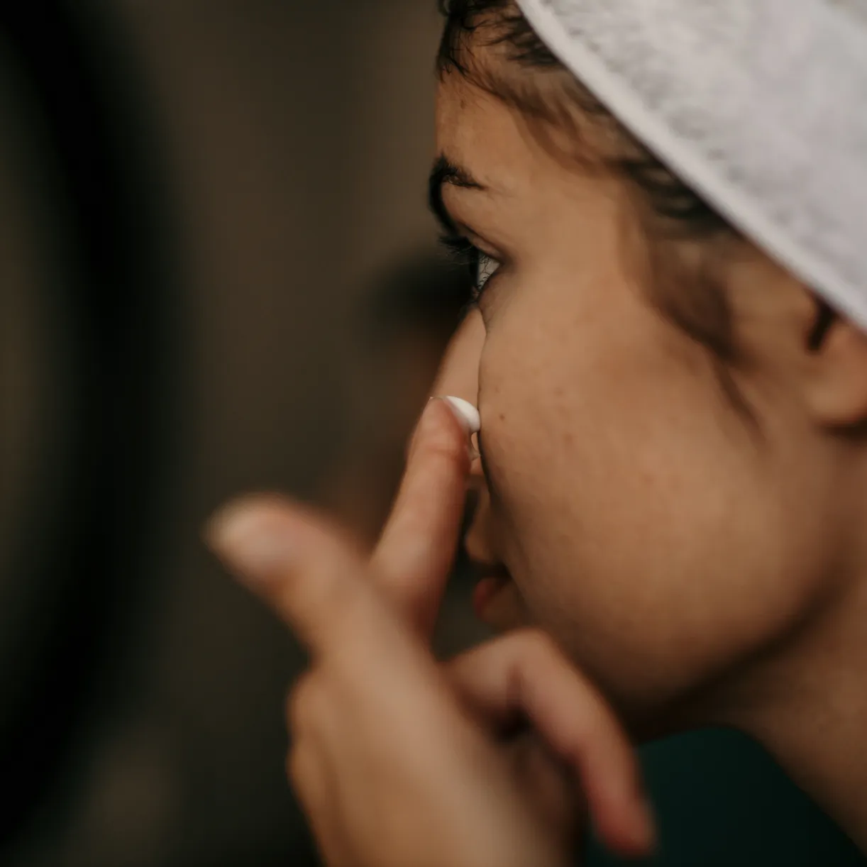 Close-up of a woman's elbow, displaying signs of dryness.