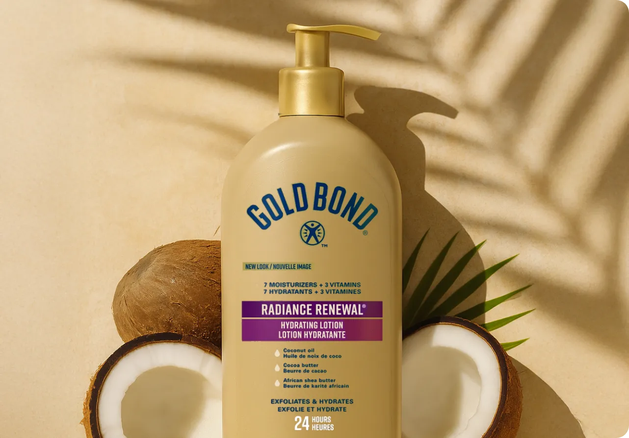 A hand about to pump some cream from a container of Gold Bond Diabetics' dry skin relief body lotion.