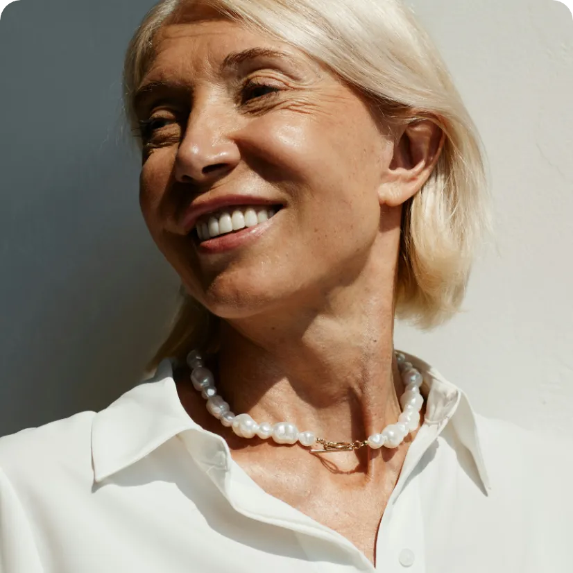 A close-up of a woman featuring natural skin texture and lines highlighting the renewal for aging skin category.