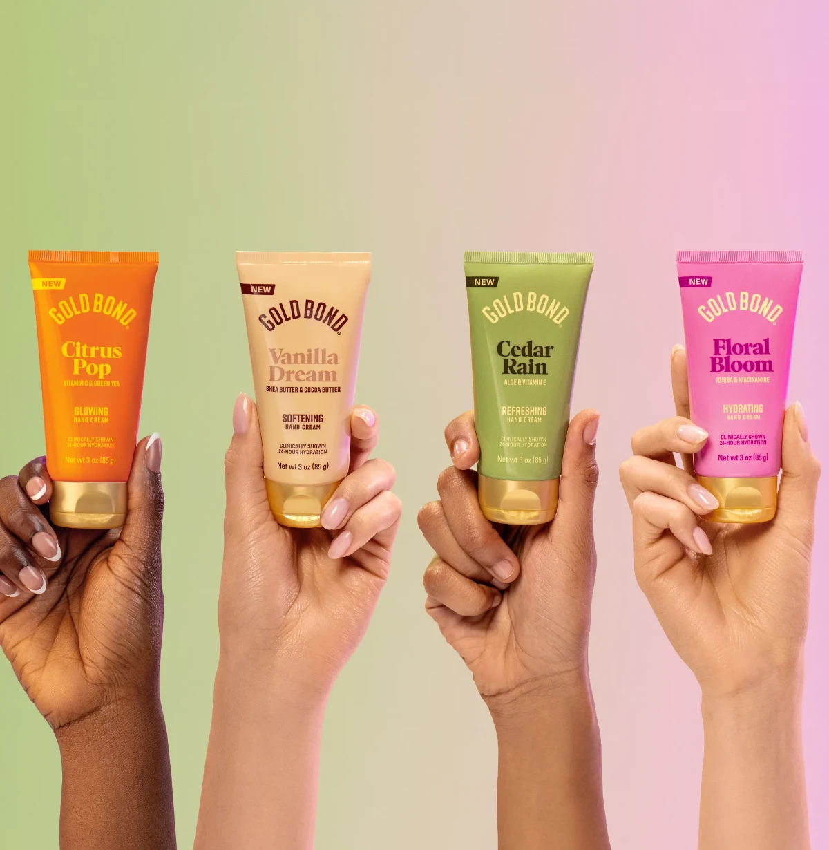 Four hands holding up the four different scented creams from the Gold Bond scented cream collection.