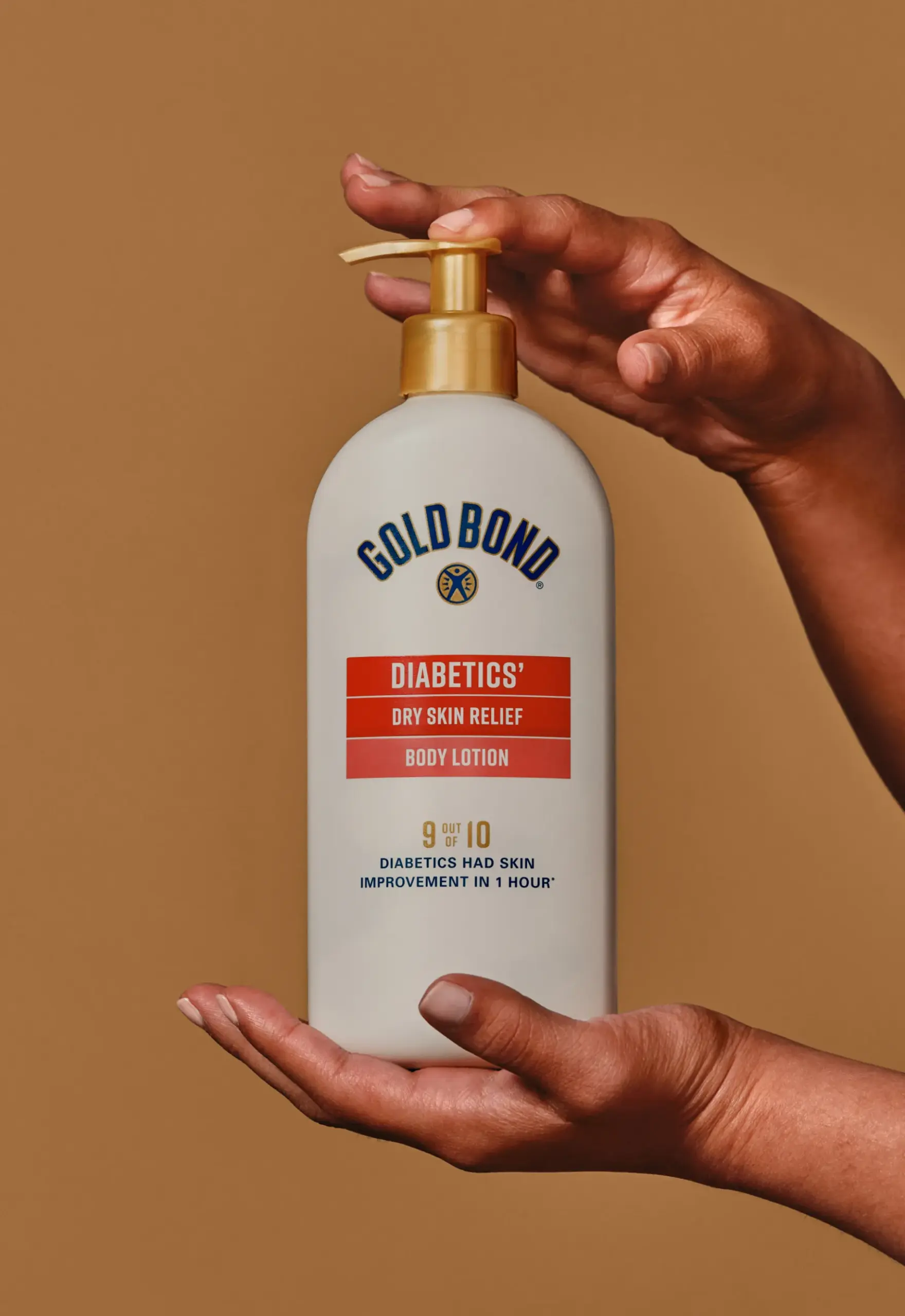 Hands holding a bottle of Goldbond Diabetic lotion