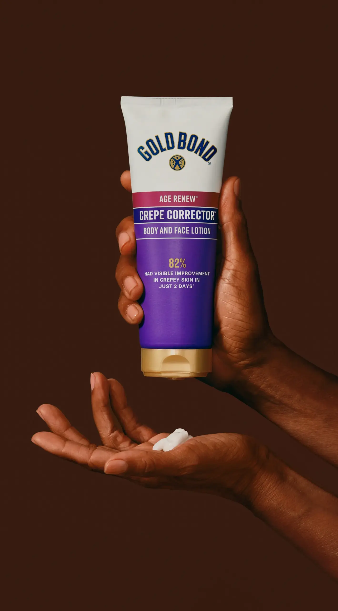 Hands squeezing Crepe Corrector lotion.